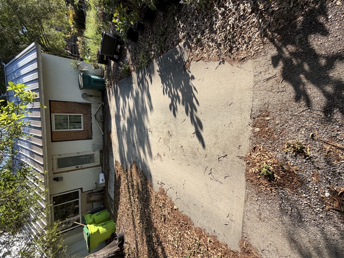 Driveway before pressure washing